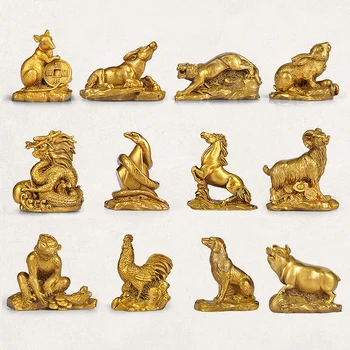 El Feng Shui y derramó doce del zodiaco rata adornos de cobre buey tigre conejo dragón serpiente caballo oveja mono de pollo perro cerdo.